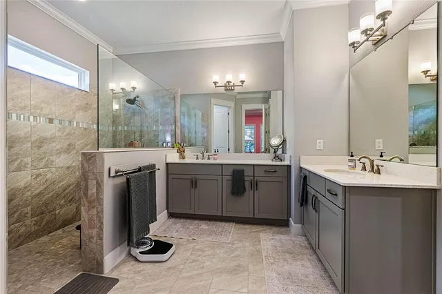 a bathroom with a sink double vanity and a mirror