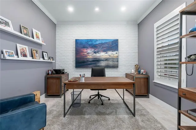 a workspace with furniture and a potted plant