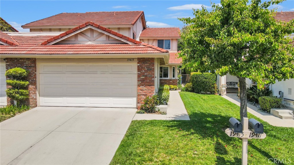 19415 Crystal Ridge Lane Porter Ranch, CA 91326 - Photo 1 of 1 front view of a house with a yard