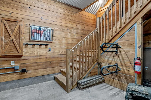 a view of a patio with table and chairs with wooden floor and fence