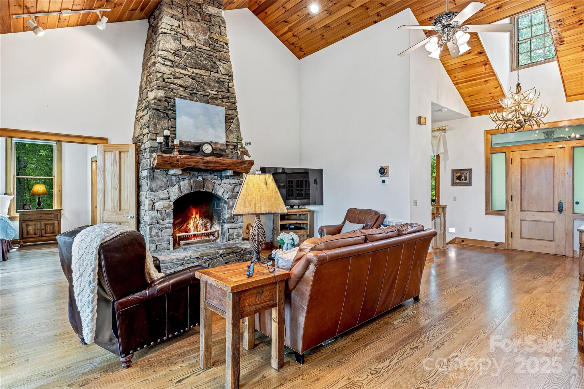 1987 Rabbit Hop Road Spruce Pine, NC 28777 - Photo 25 of 47 a living room with furniture a fireplace and a table