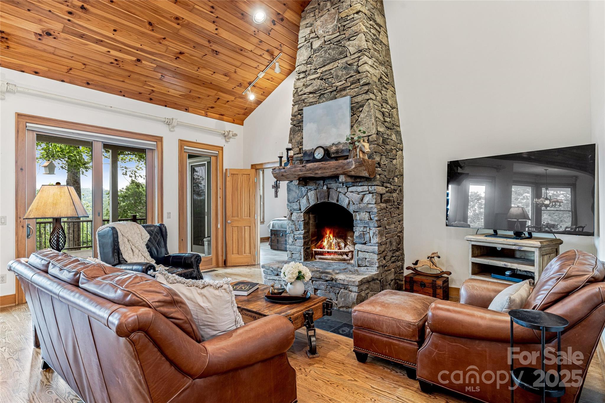 1987 Rabbit Hop Road Spruce Pine, NC 28777 - Photo 28 of 47 a living room with furniture a fireplace and a table
