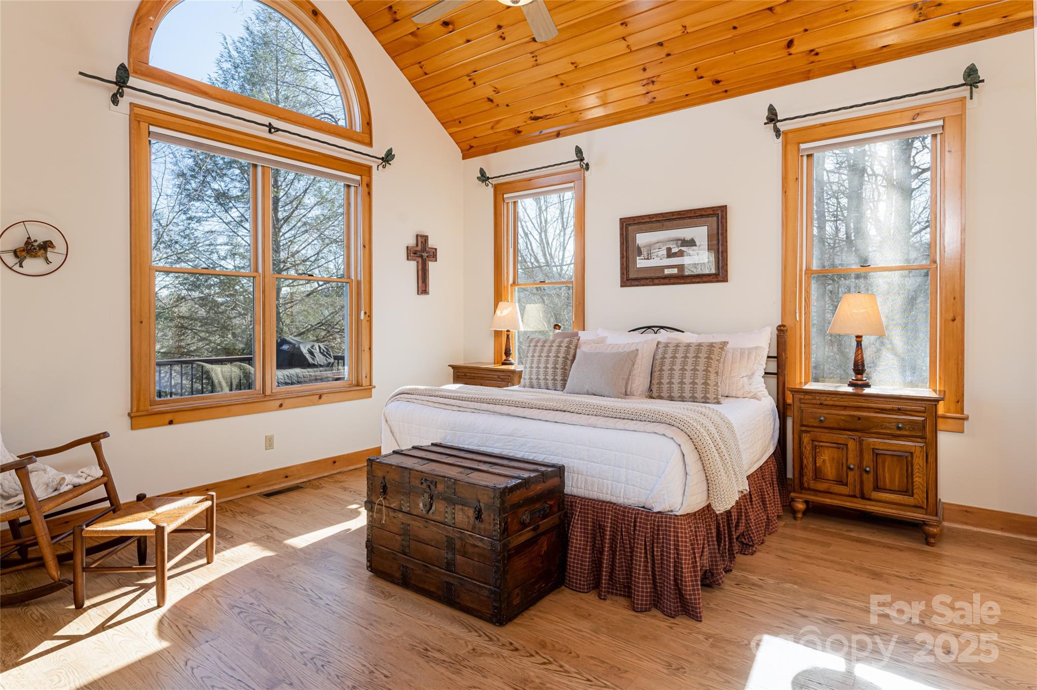 1987 Rabbit Hop Road Spruce Pine, NC 28777 - Photo 30 of 47 a spacious bedroom with a bed and wooden floor