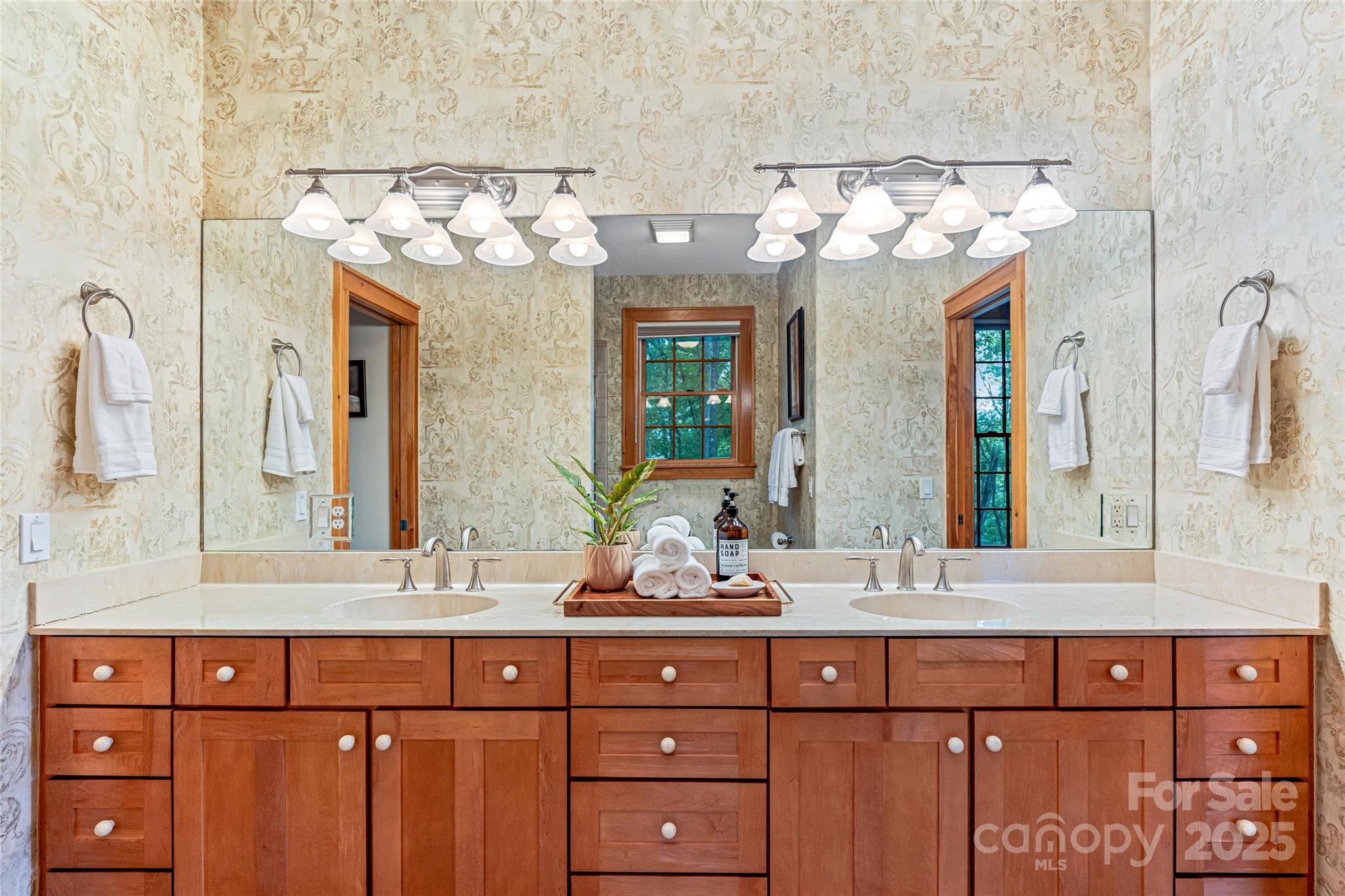 1987 Rabbit Hop Road Spruce Pine, NC 28777 - Photo 35 of 47 a bathroom with a double vanity sink and a mirror