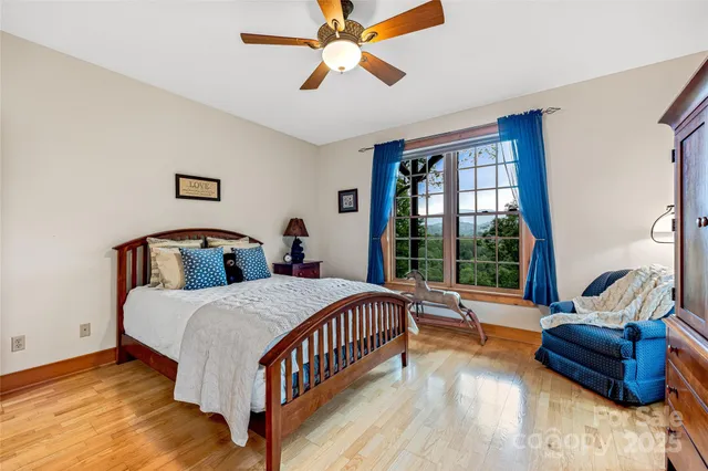 a view of a city with lush green forest