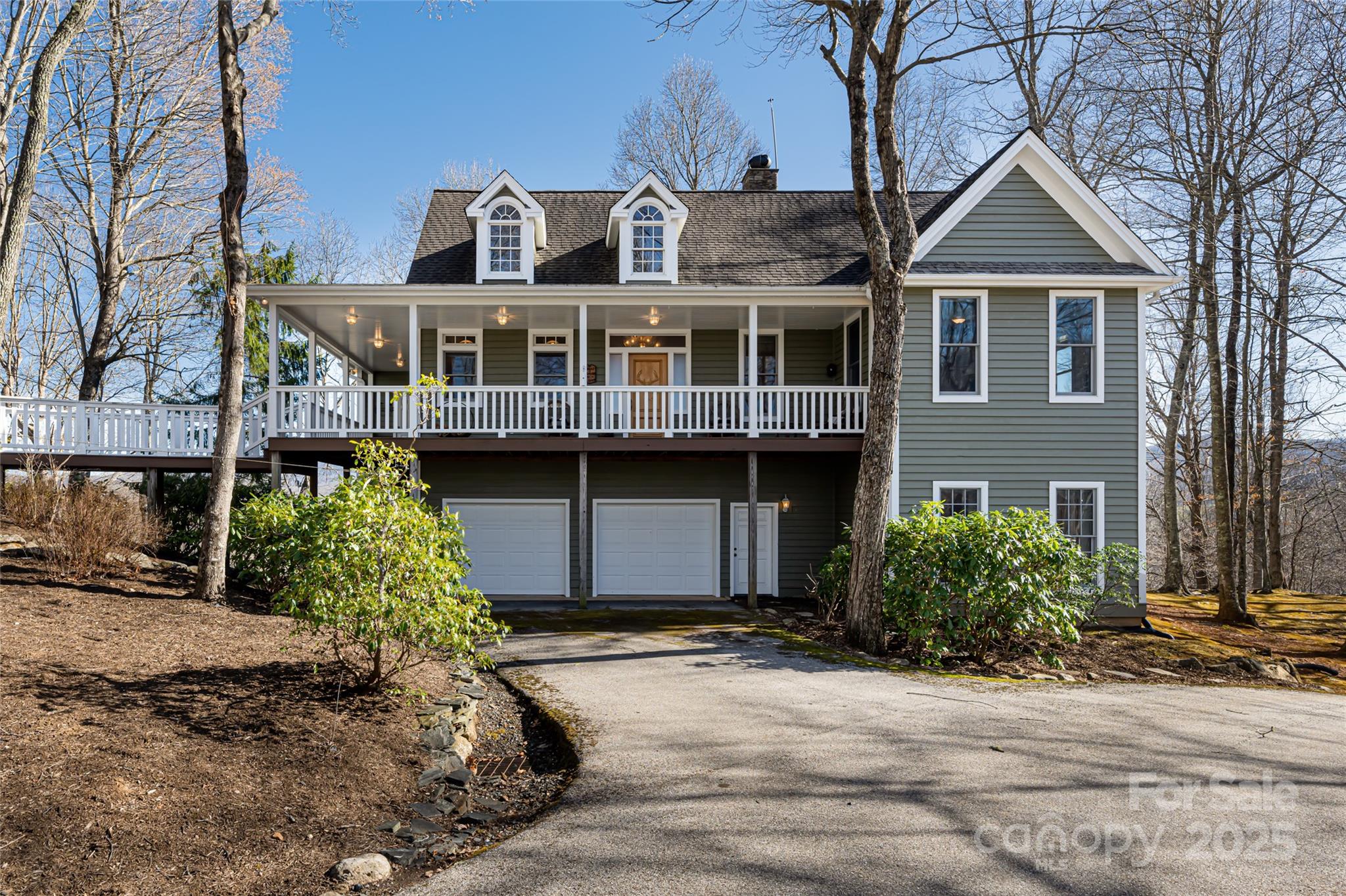 1987 Rabbit Hop Road Spruce Pine, NC 28777 - Photo 5 of 47 a front view of a house with a yard