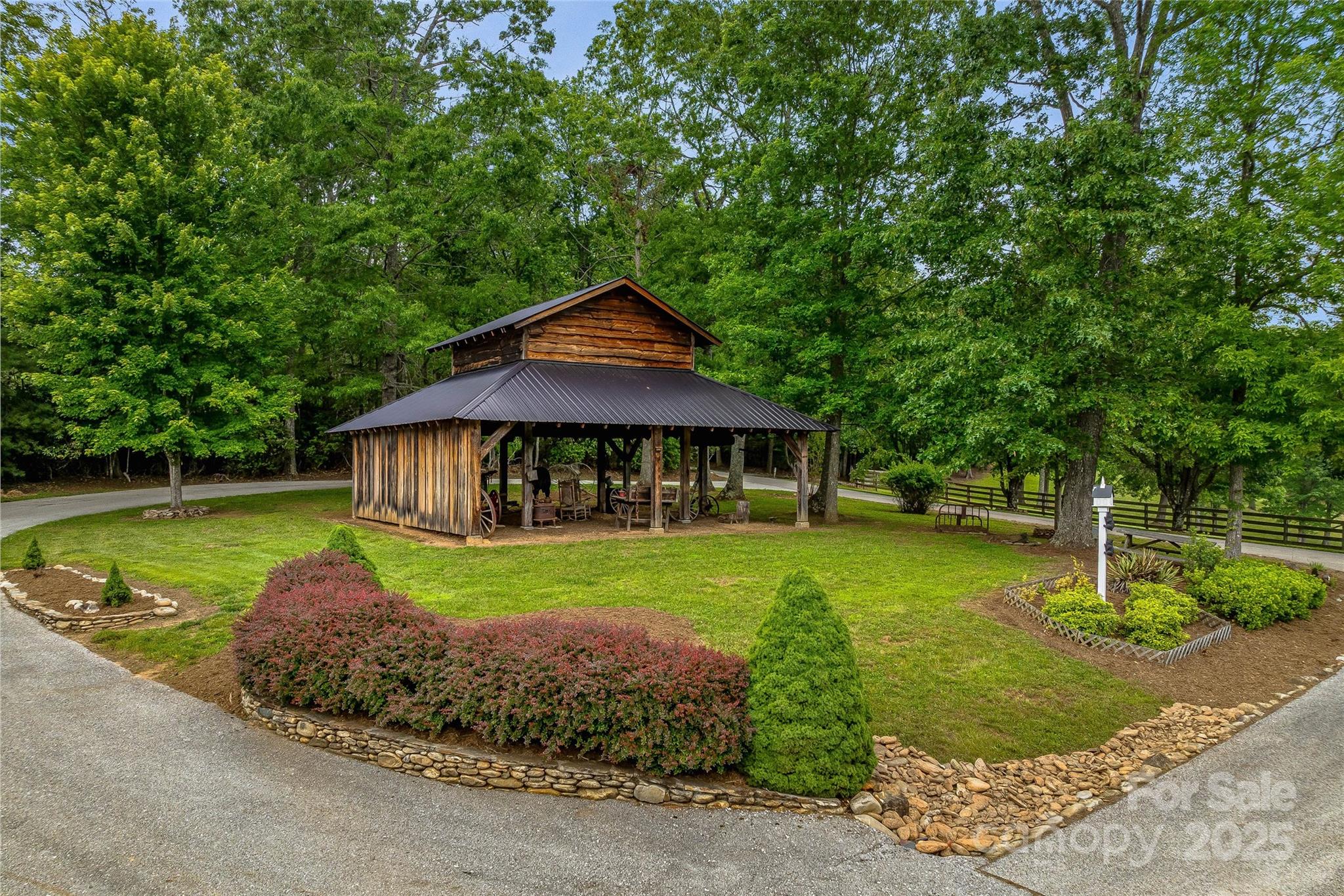 1987 Rabbit Hop Road Spruce Pine, NC 28777 - Photo 9 of 47 a front view of a house with garden