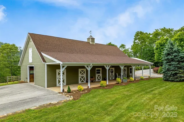 a view of a house with a yard and plants