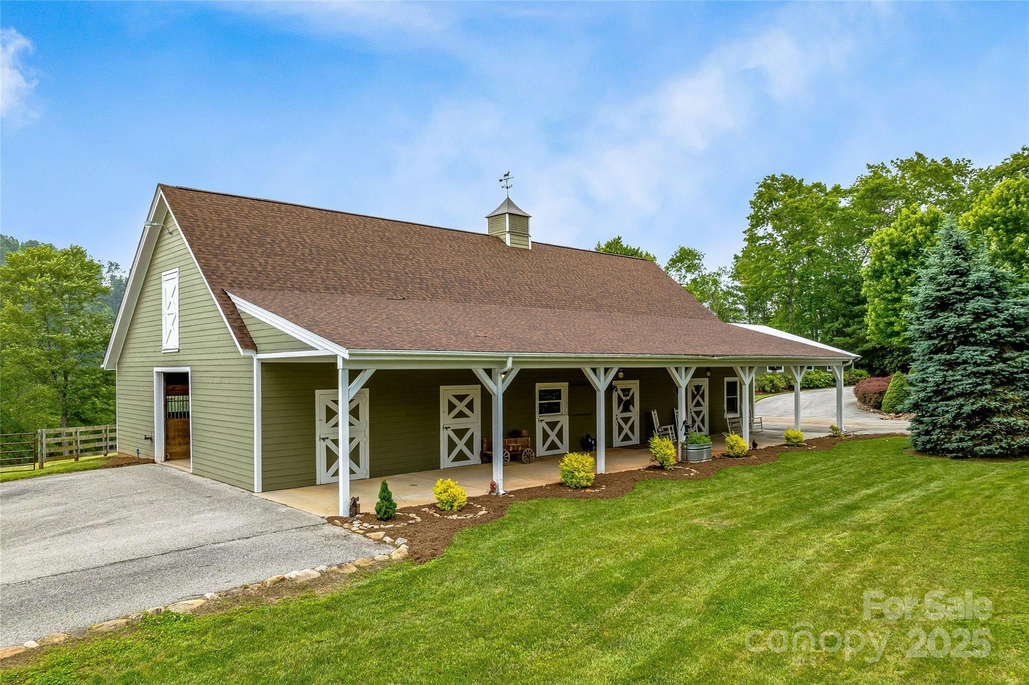 1987 Rabbit Hop Road Spruce Pine, NC 28777 - Photo 10 of 47 a view of a house with a yard and sitting area