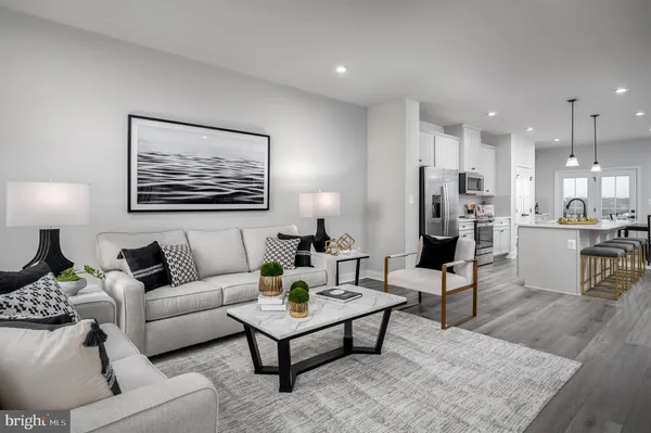 a living room with furniture and a table