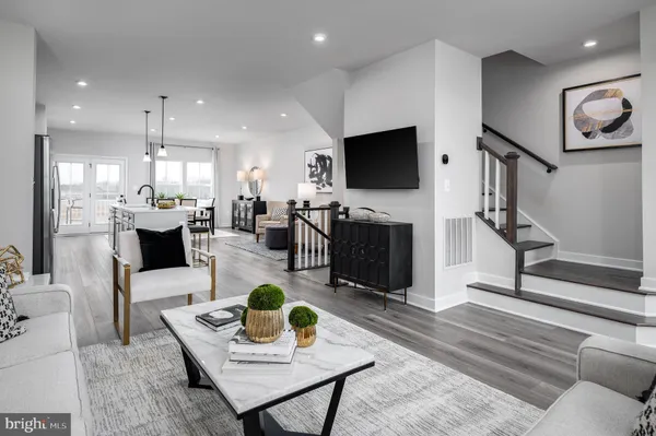 a living room with fireplace furniture and a flat screen tv