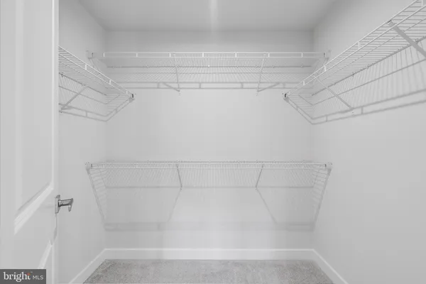 a view of a room with racks on the wall