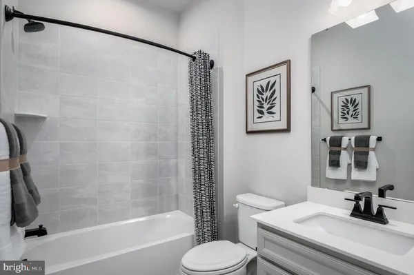 a bathroom with a sink toilet and a bathtub