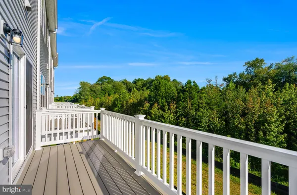 a view of a balcony with wooden floor