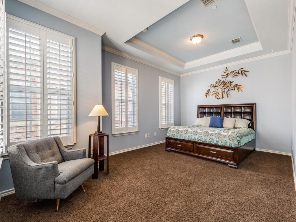 15741 Seabolt Place, Unit 28 Addison, TX 75001 - Photo 16 of 40 a bedroom with a bed and a couch