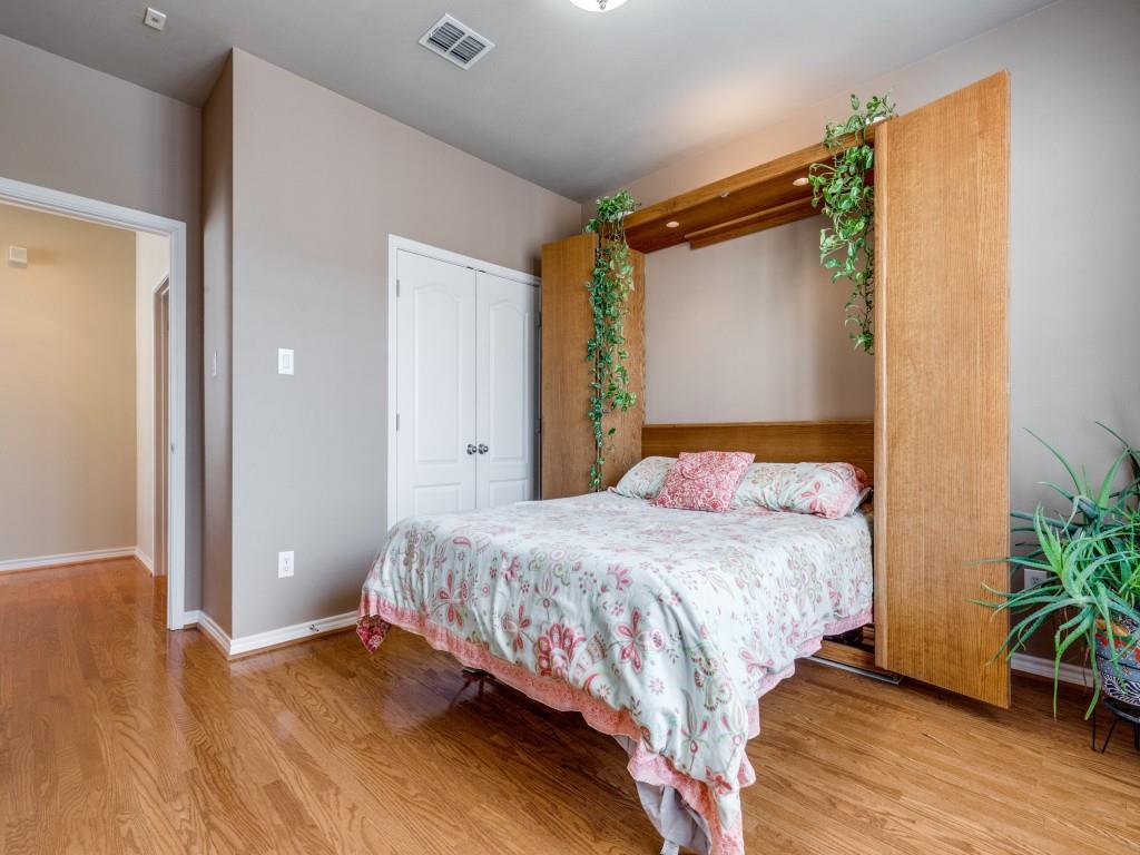 15741 Seabolt Place, Unit 28 Addison, TX 75001 - Photo 22 of 40 a bedroom with a bed and a potted plant