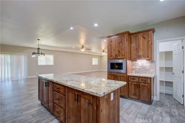 a kitchen with a stove and a refrigerator