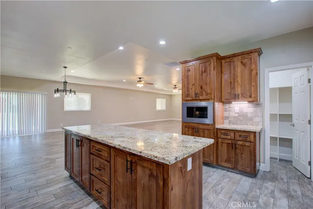 a kitchen with a stove and a refrigerator