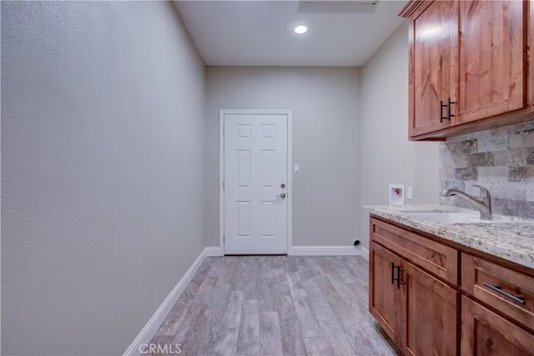 an empty room with wooden floor