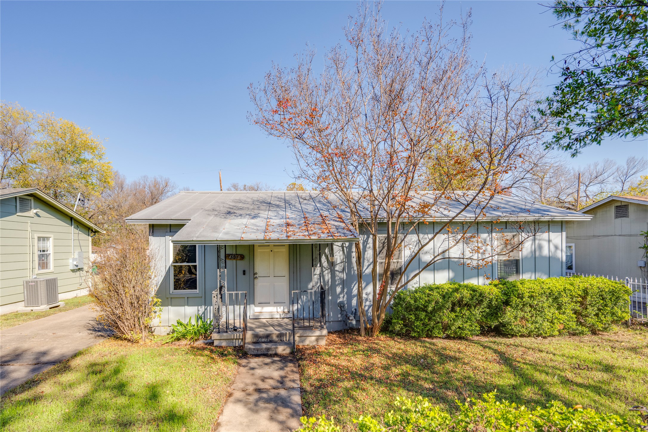 4804 Tanney Street Austin, TX 78721 - Photo 1 of 40 A classic facade with a welcoming porch and mature landscaping awaits.