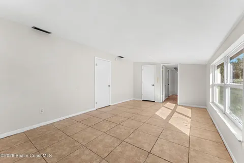 a hallway with a washer and dryer