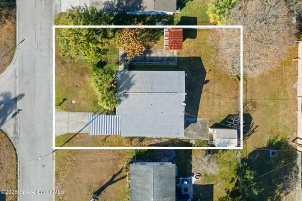 an aerial view of a house with a garden