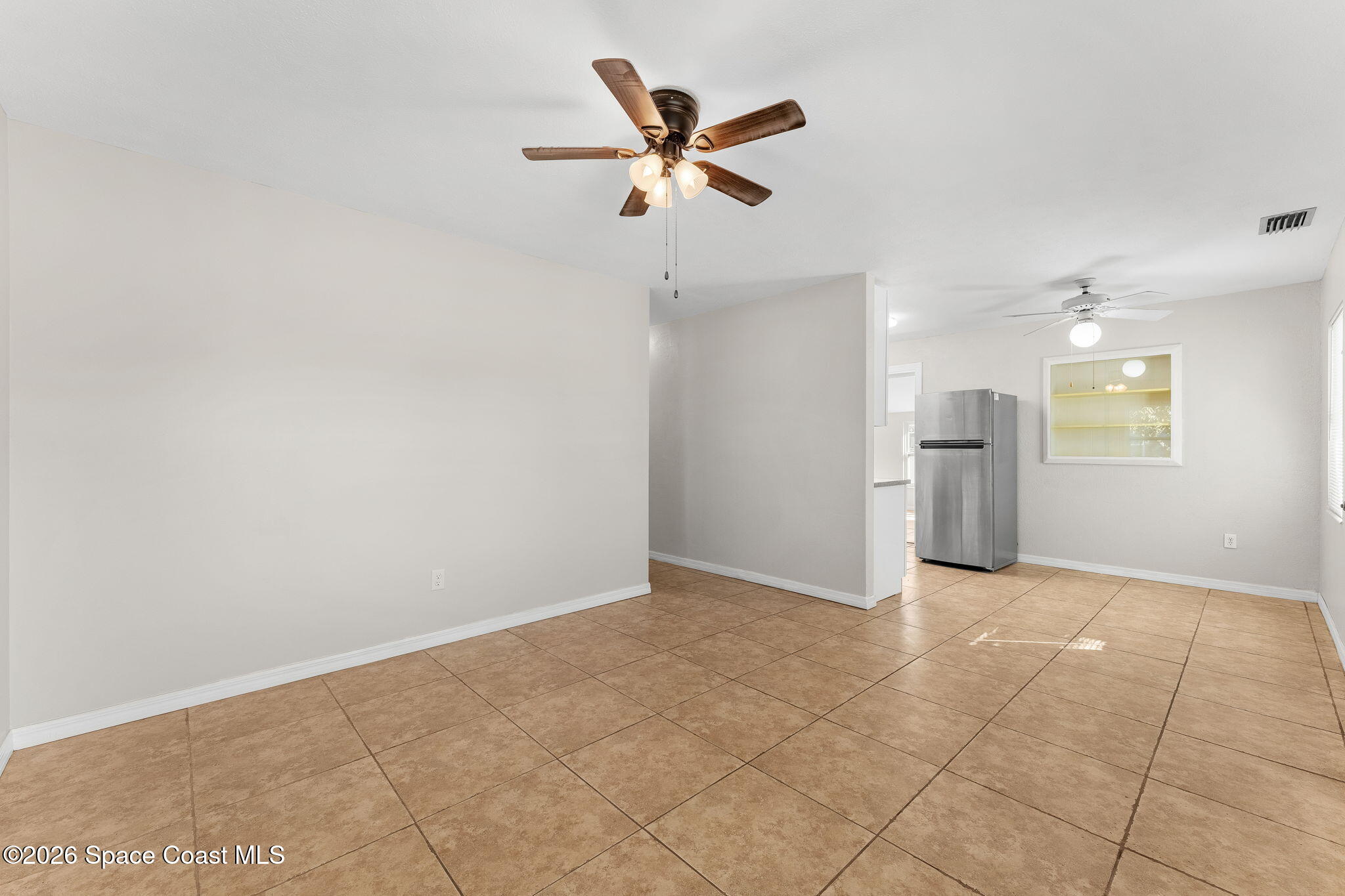1045 Collins Street Melbourne, FL 32935 - Photo 5 of 27 Living Room/ Kitchen