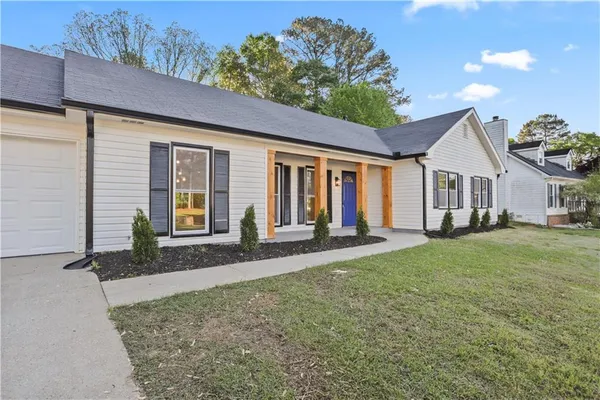 front view of a house with a yard