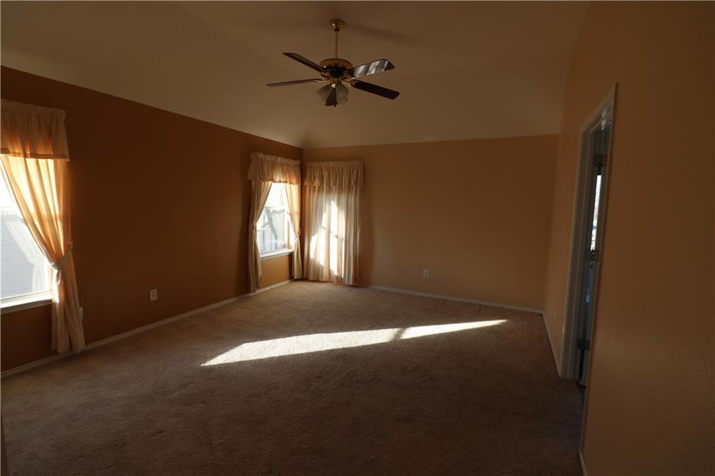 4341 Brinker Court Plano, TX 75024 - Photo 14 of 21 a view of a livingroom with a ceiling fan and window