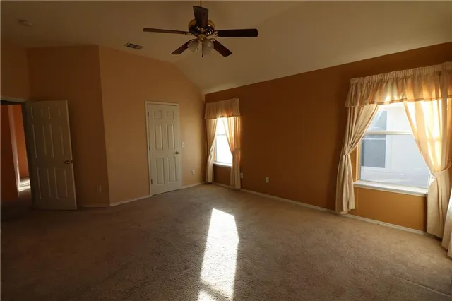 a spacious bathroom with a double vanity sink and mirror