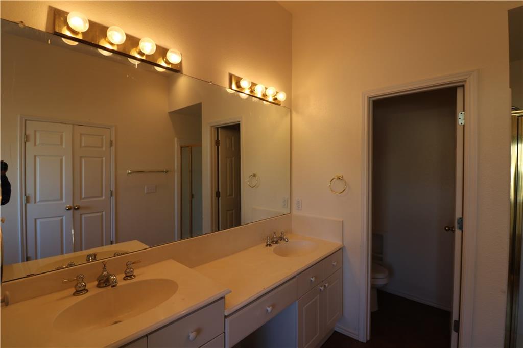 4341 Brinker Court Plano, TX 75024 - Photo 18 of 21 a bathroom with a sink double vanity and a mirror