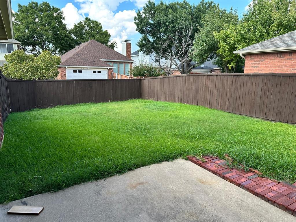 4341 Brinker Court Plano, TX 75024 - Photo 21 of 21 a backyard of a house with lots of green space