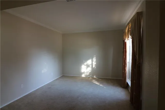 a view of room with window and lamp