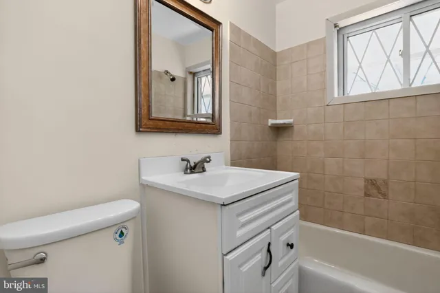 a bathroom with a sink toilet and vanity