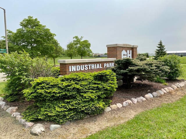 Lot 13 Duncan Place Woodstock, IL 60098 - Photo 3 of 8 a view of a sign board with garden