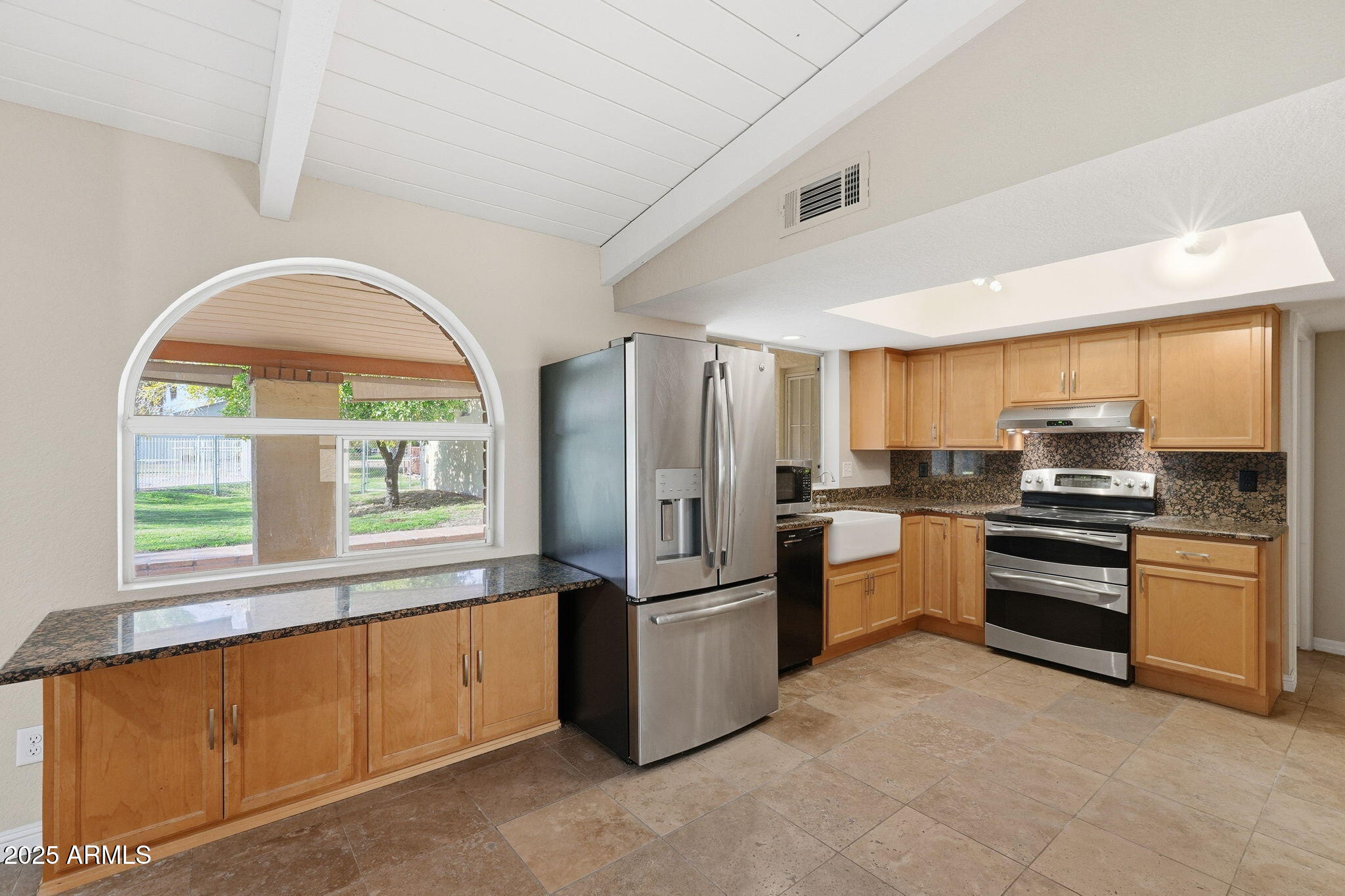 914 South 132nd Street Gilbert, AZ 85233 - Photo 19 of 55 a kitchen with stainless steel appliances granite countertop a refrigerator a stove a sink and a large window