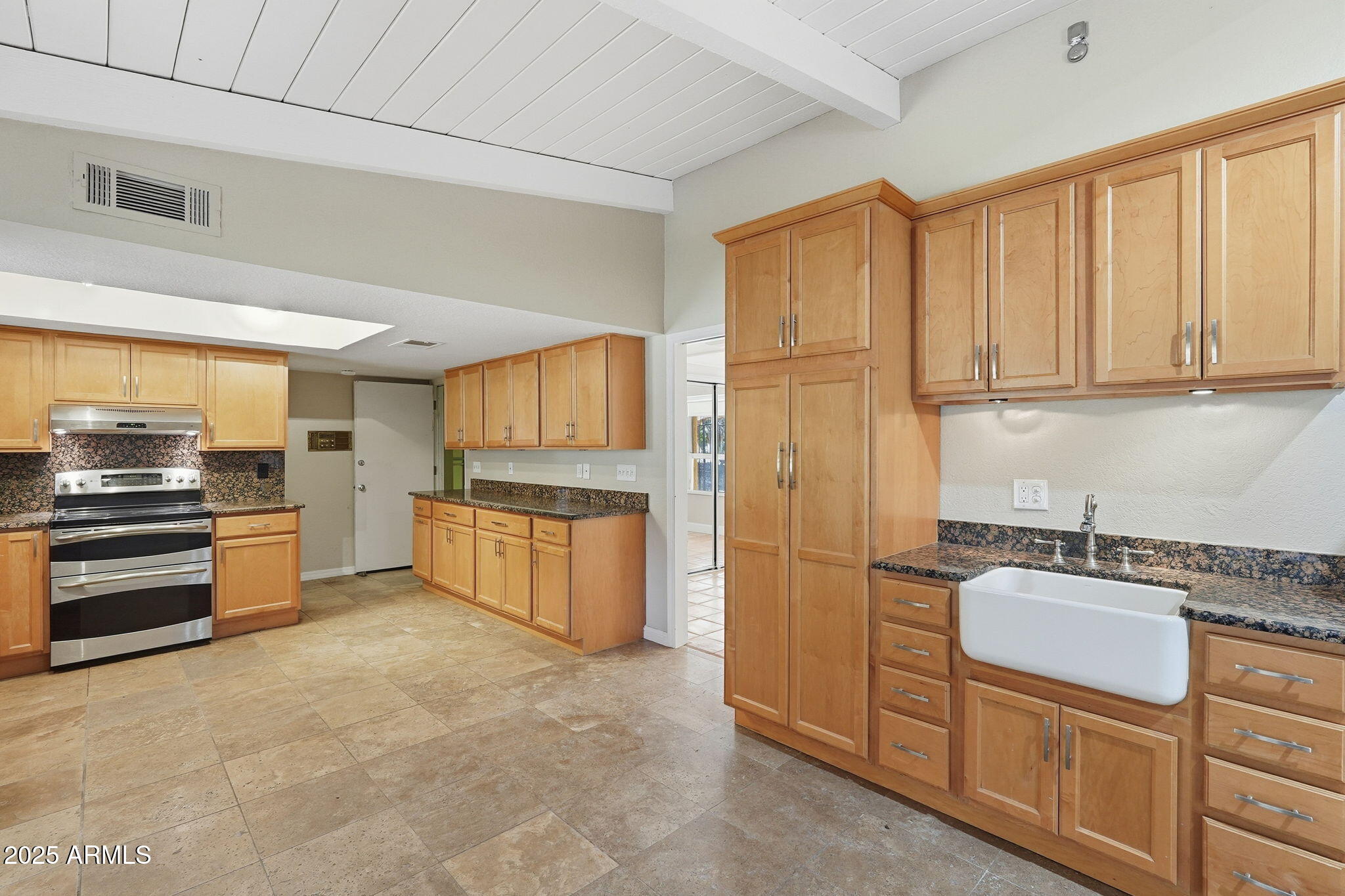 914 South 132nd Street Gilbert, AZ 85233 - Photo 21 of 55 a kitchen with stainless steel appliances granite countertop a refrigerator and a stove top oven