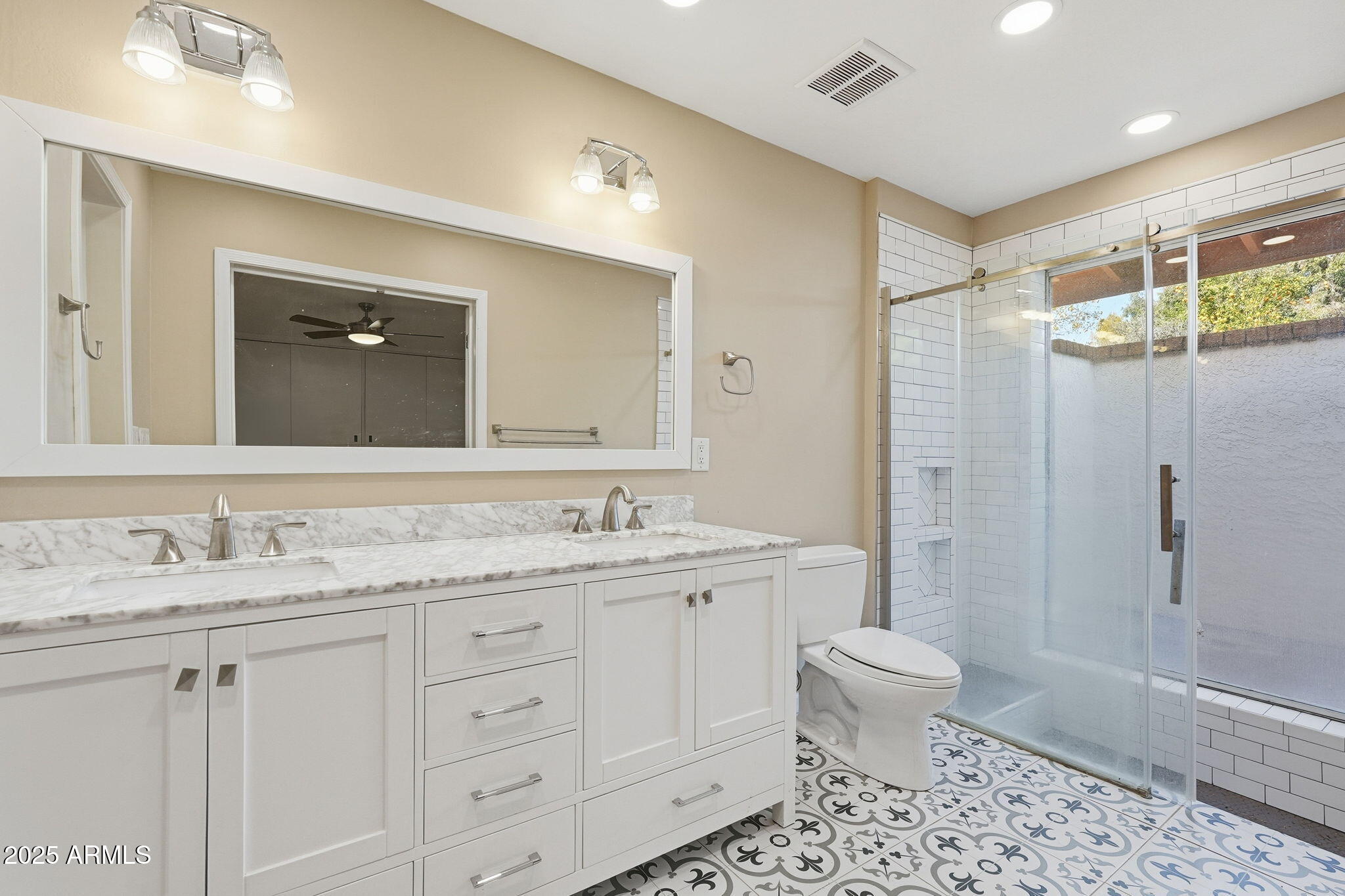 914 South 132nd Street Gilbert, AZ 85233 - Photo 27 of 55 a bathroom with a double vanity sink toilet mirror and shower