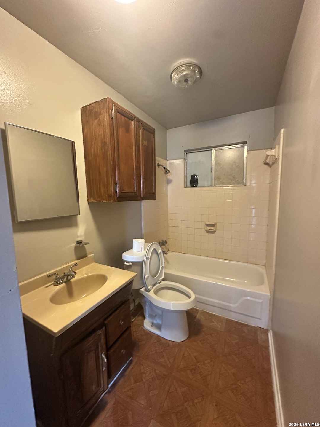 515 Clark Avenue San Antonio, TX 78210 - Photo 7 of 11 a bathroom with a sink and a mirror