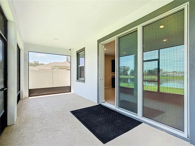 an aerial view of a house with garden space and outdoor seating