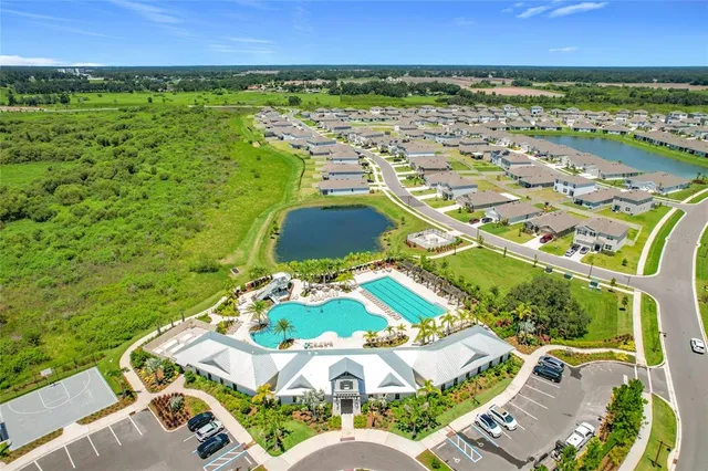 a view of a swimming pool with a patio