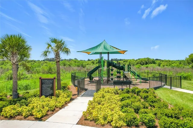 a view of a swimming pool with an outdoor seating