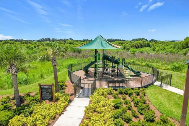 a view of a swimming pool with a yard