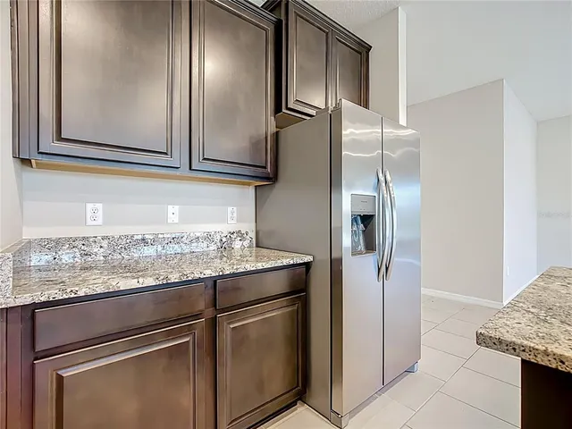 a kitchen with a sink and a stove top oven