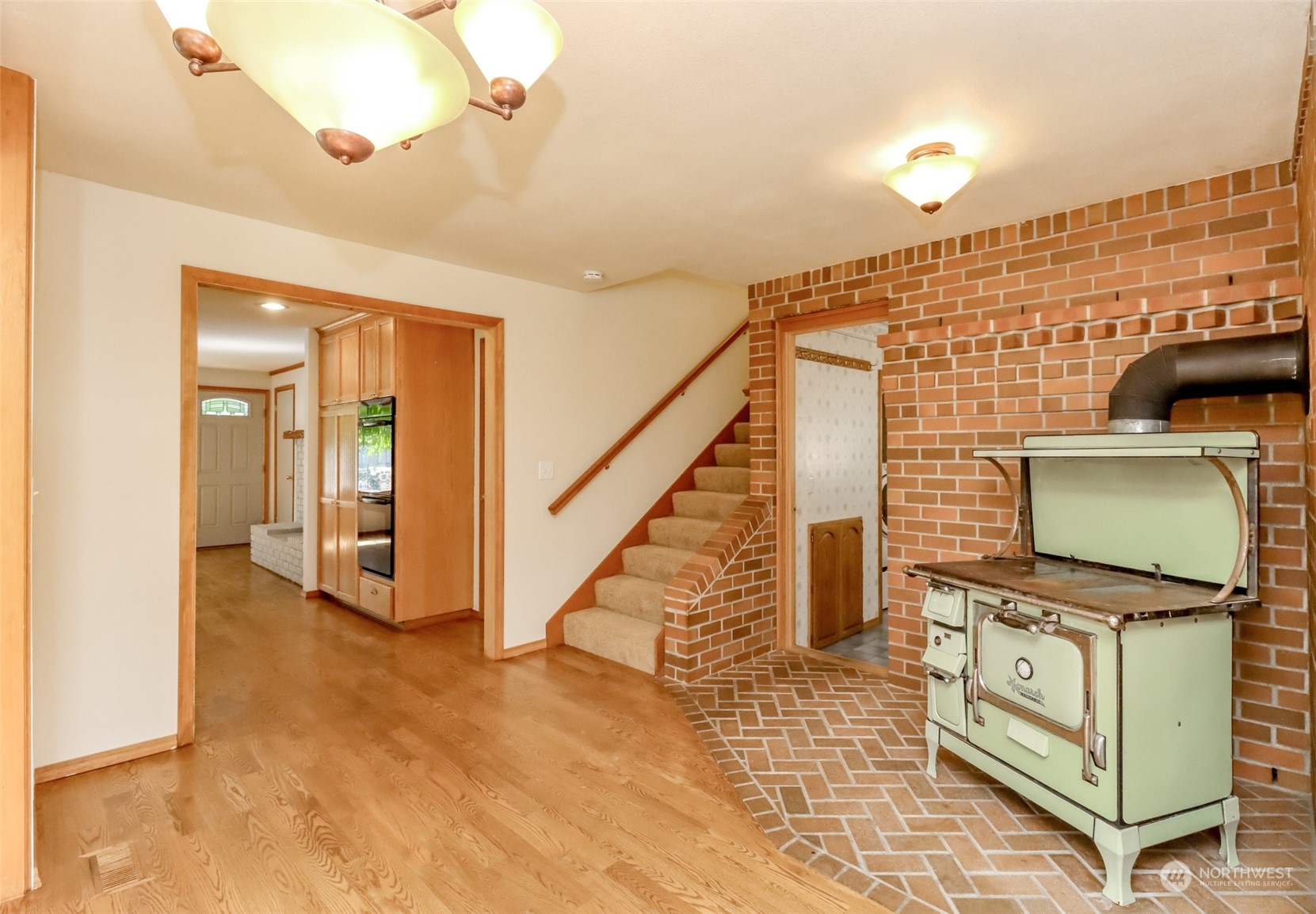 14419 178th Avenue Southeast Renton, WA 98059 - Photo 12 of 40 a view of a livingroom with wooden floor and staircase