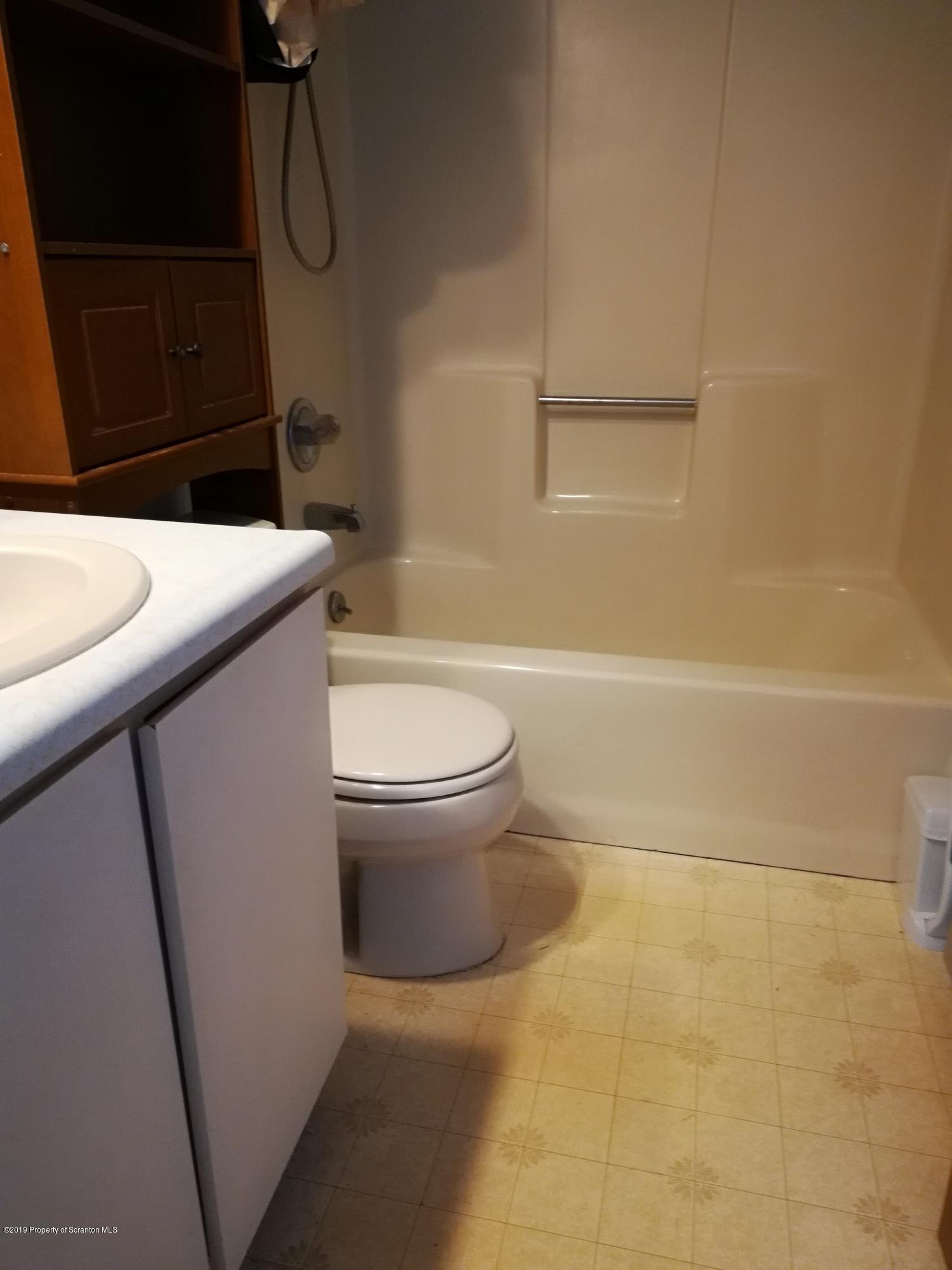 48 Seeley Road Lake Ariel, PA 18436 - Photo 11 of 23 a bathroom with a sink a toilet and shower
