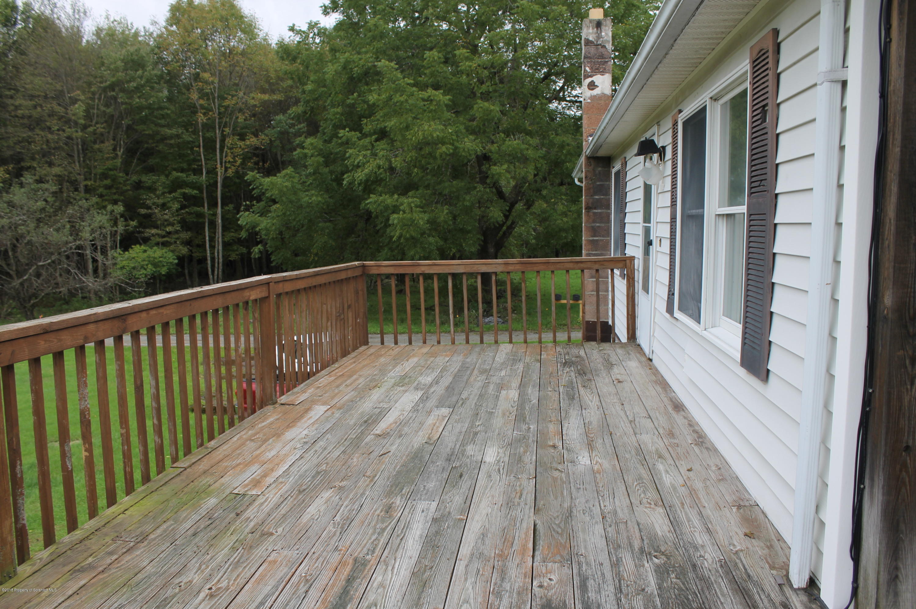 48 Seeley Road Lake Ariel, PA 18436 - Photo 17 of 23 a view of balcony with wooden floor and fence