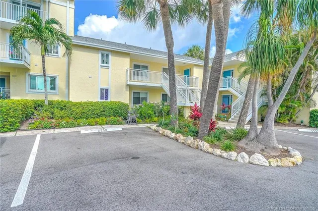 a front view of a house with a yard and a garage