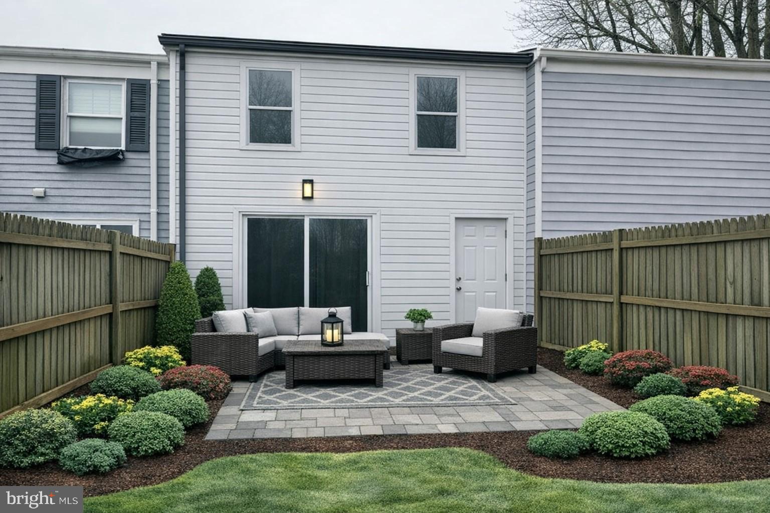 411 Clover Court Taneytown, MD 21787 - Photo 14 of 17 a view of a patio with couches chairs and potted plants