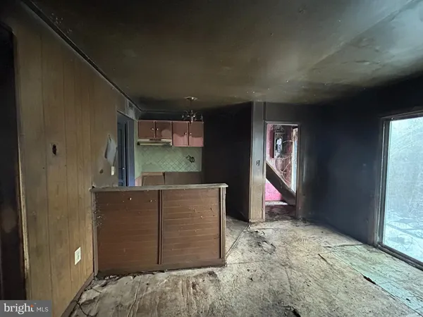 a view of a livingroom with a kitchen